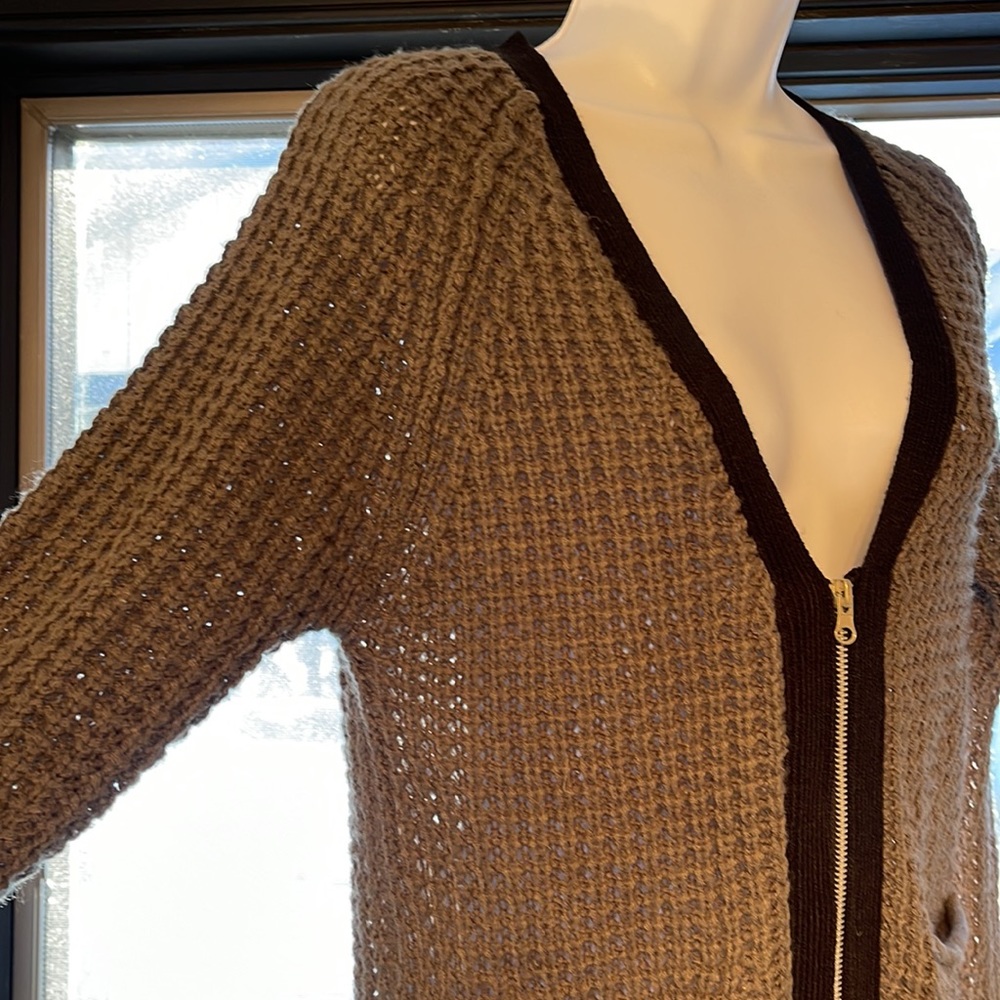 Grey cardigan.